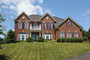 Exterior of a large brick-faced luxury home
