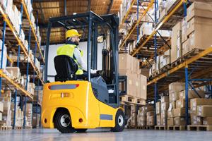 man on a forklift in warehouse