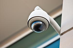 High tech overhead security camera on a building