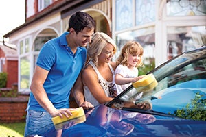 Family washing their car