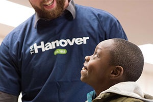 Hanover volunteer helping a child