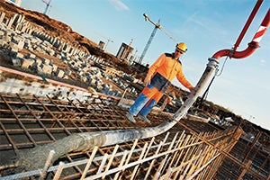 Construction worker pouring concrete 