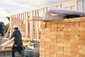 Construction site with pile of wood