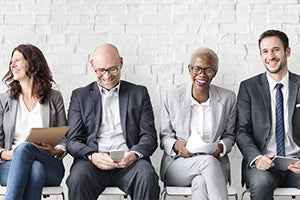 Employees sitting and smiling 