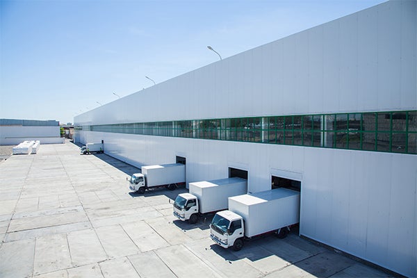 Trucks parked at a warehouse 