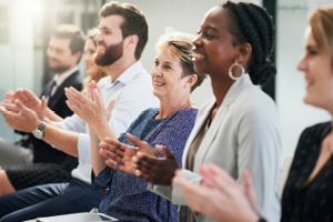 men and women clapping