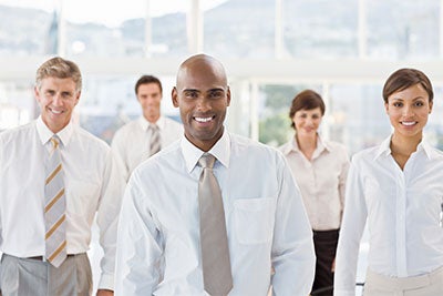 group of professional men and women smiling