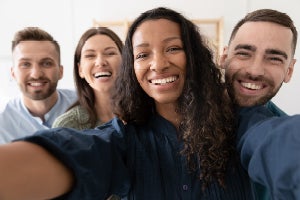 happy employees taking a selfie