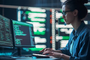 Software developer on a work computer