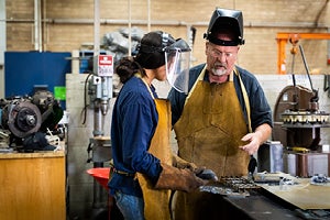 A teacher and a student working together at a technical high school