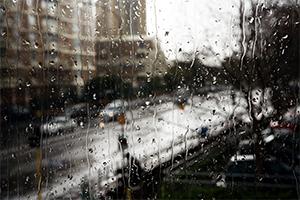 Window view of a rainy day in the city