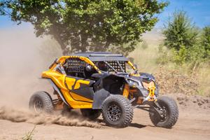 rev-up_orv-buggy.jpg Yellow dune buggy driving through desert