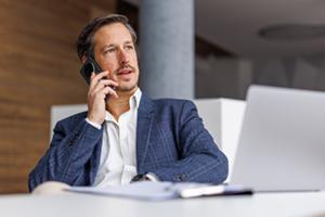 Businessman on phone at his desk