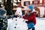 Father and son building snowman