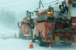 Work trucks in the snow