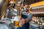 man serving beer