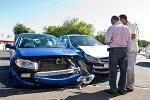 two people investigating a car accident 