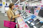 Woman shopping and looking at a digital tablet 