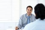 Happy business partners in a conference room having a meeting