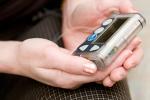 woman holding insulin pump