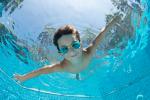 kid swimming in pool