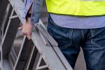 man carrying a ladder