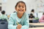 girl sitting at school desk