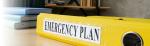 yellow binder with the words emergency plan written on it
