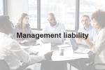 Text reading management liability, overlaid on a picture of a business meeting