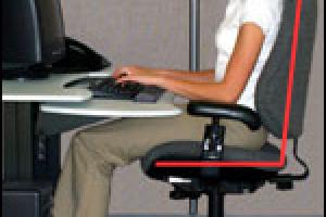 woman sitting at computer showing posture