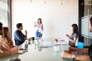 Woman giving a presentation at a tech startup company.