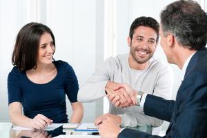 Couple meeting with professional shaking hands