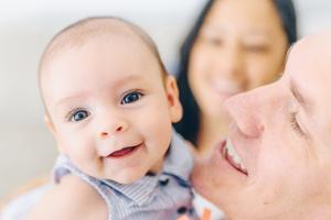 parents with a smiling baby