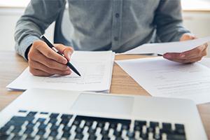 Businessman examining documents 