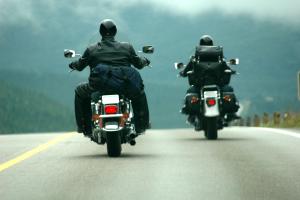 Two bikers riding motorcycles.